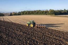 A tractor ploughing a field near Cressage, Shropshire