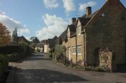 Village street of stone cottages in East Coker, Somerset
